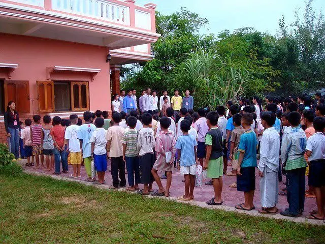 Students in Cambodia lining up to sing the National Anthem