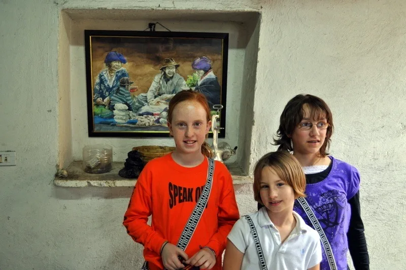 10 year old students explore Ecuador's weaving cottages.