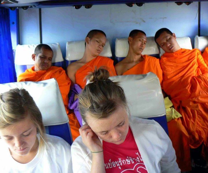 Monks and Randy's daughter on a Thailand bus!