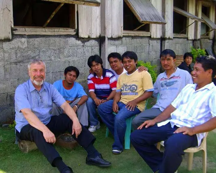 Bill in with students in a remote part of the Philippines.