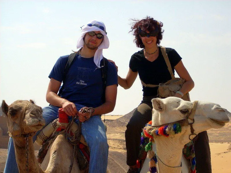 Holly and Chris riding camels in Egypt.