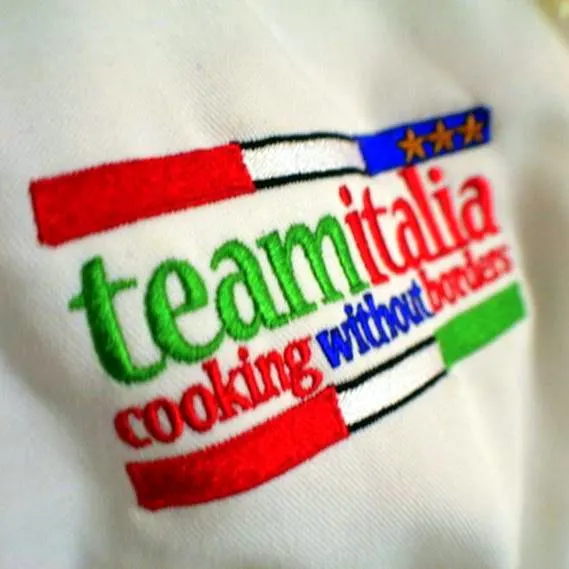 The logo on the chef suits of James's students.