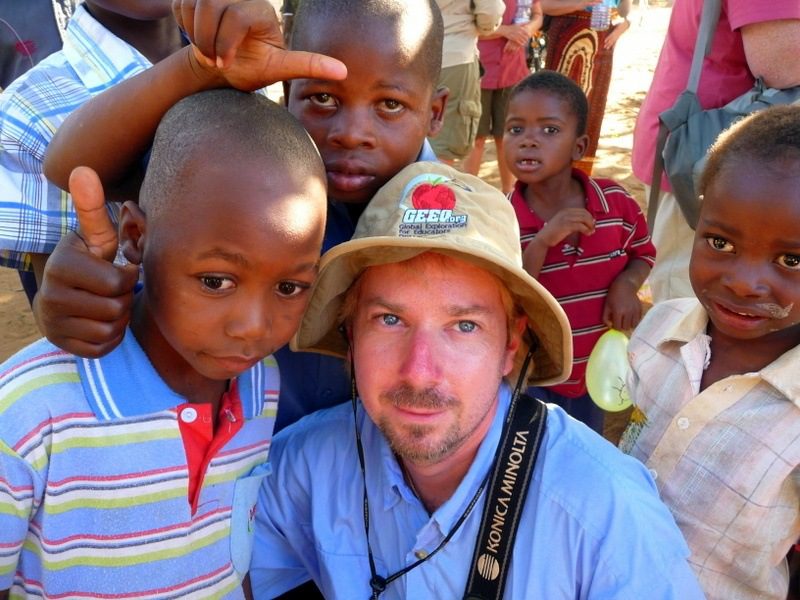 Michael surrounded by new friends in Mozambique