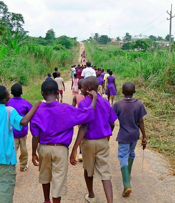 Ghana students returning from rain forest planting.