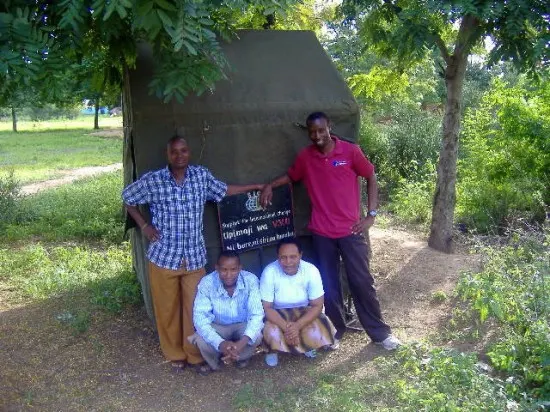 The SIC testing team in front of the counseling tent in Kisangaji village, Mwada.