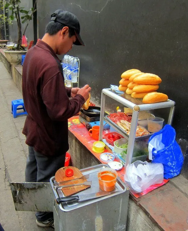 One of many street baguette vendors in Hanoi, Vietnam. Delicious , nutritious and ubiquitous!