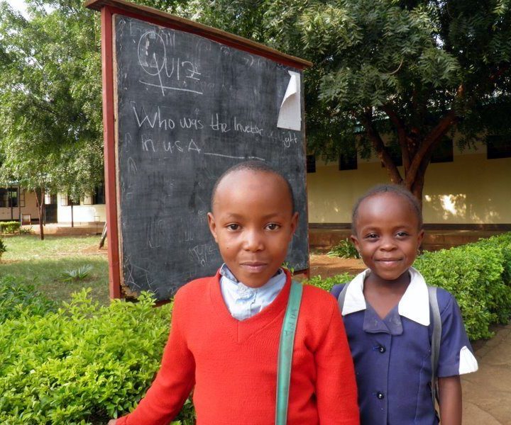 Children in Tanzania asking Francine a question.