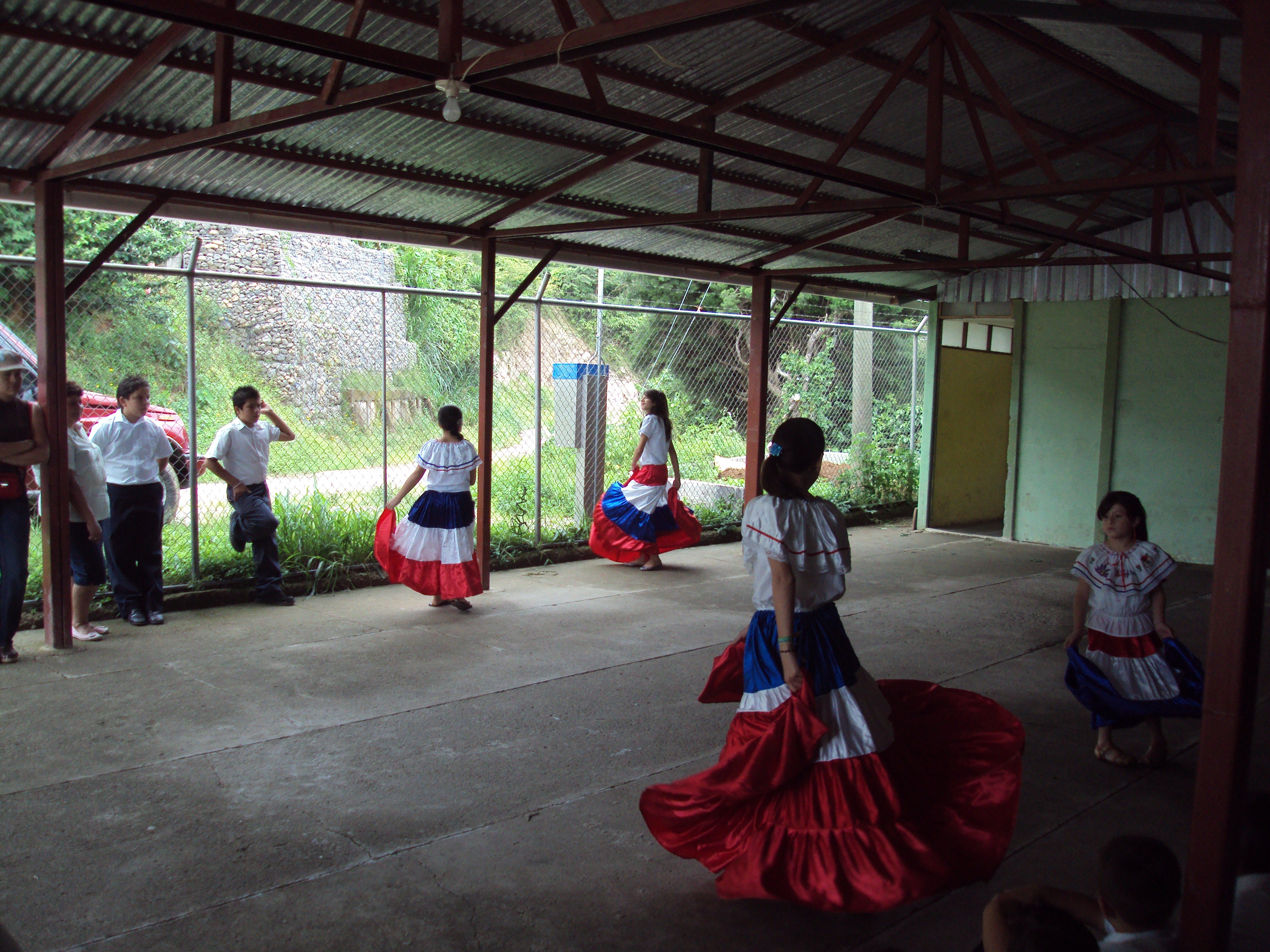 Students doing "baile tipico" or traditional folk dance.