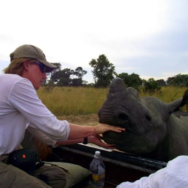 James feeding a Rhino in Zimbabwe. Wow!!!