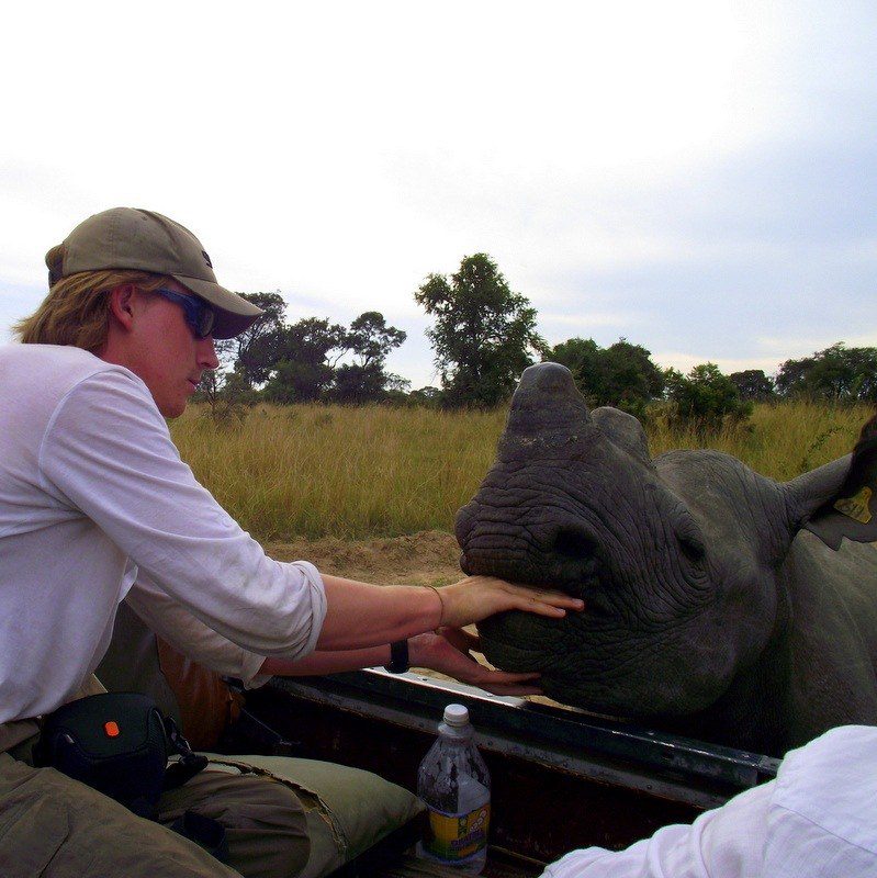 James feeding a Rhino in Zimbabwe. Wow!!!