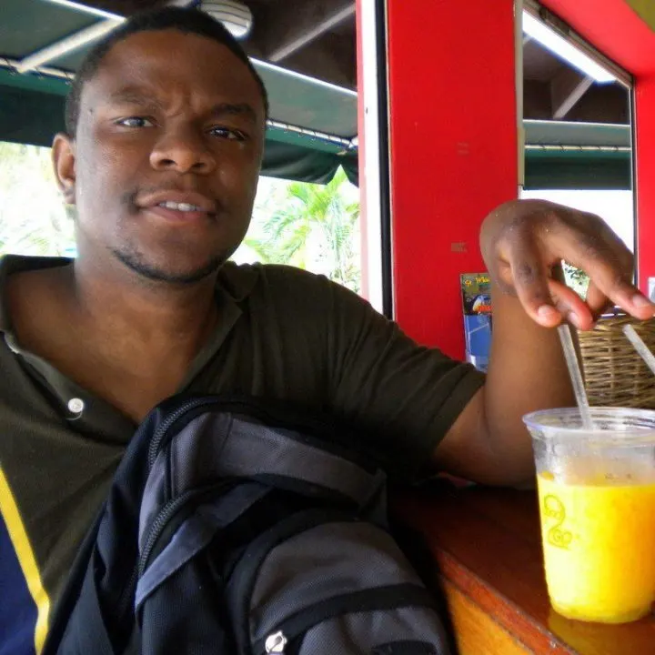 Winston in St. Maarten with a delicious juice.