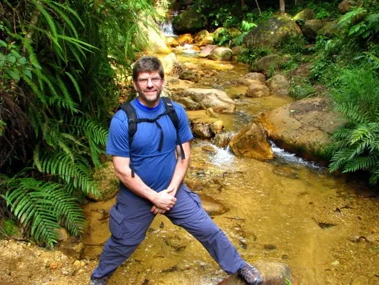 Tim, ruggedly hiking in Honduras.