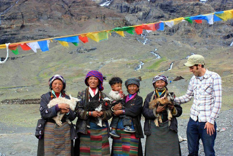 Chris with new friends during Tibet travel.