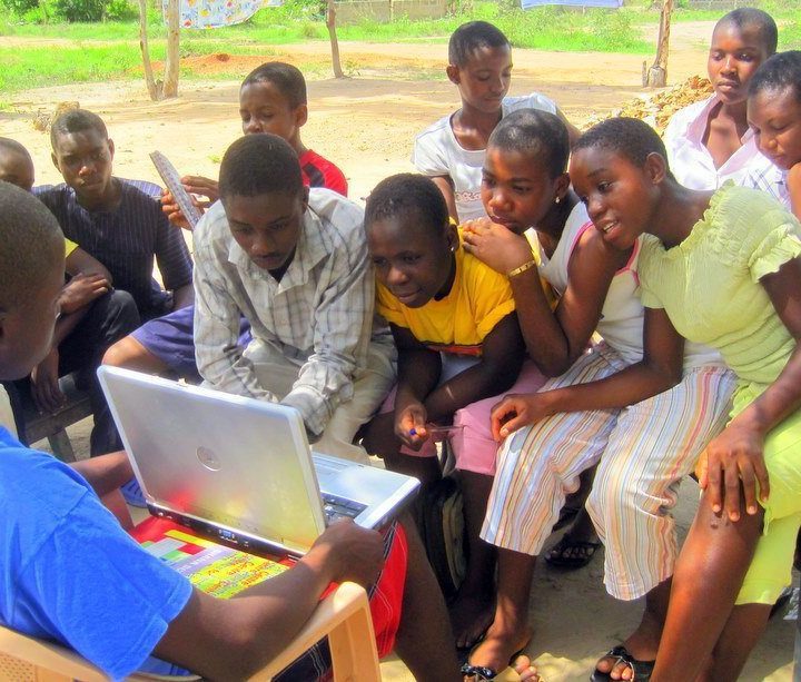 My students in Ghana reading a blog article I wrote about them!