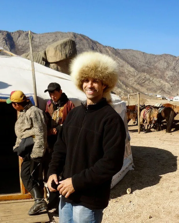 Sporting a very cool hat while traveling in Mongolia.
