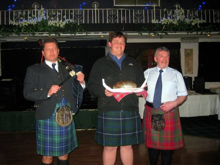 Presentation of Haggis at the Scottish ceilidh by one of Gail's students.