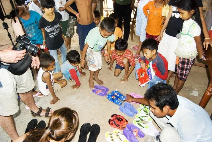 Donating sandals and clothes to an orphanage in Cambodia.