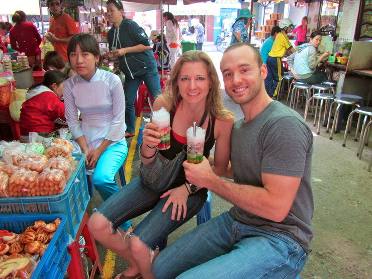 Maggie and her husband enjoying the drink Chè at a market in Saigon, Vietnam.