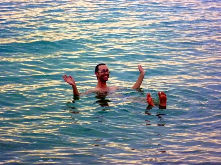 Sam floating in the Dead Sea, Jordan.