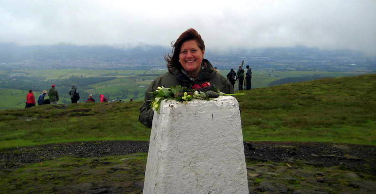 Alexandra at the top of Pendle Hill in England. 