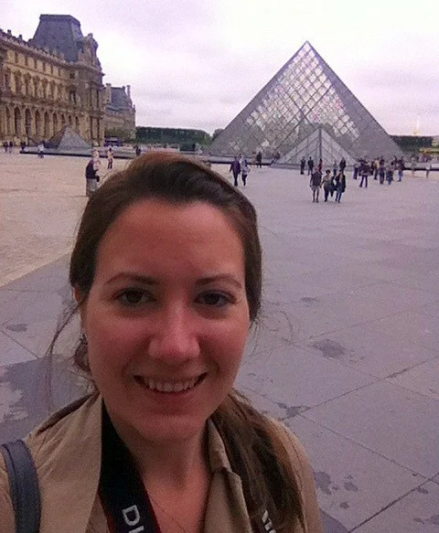 Katie near the Louvre, in Paris (she visited the Musée des Arts Décoratifs, and the Musée de la Mode et du Textile).