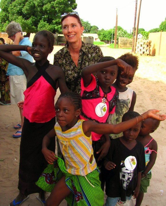 During a visit to the mayorâ€™s compound in Sokone, Senegal, children greeted Arlisâ€™s group with enthusiasm. Later, they would dance, eat, and enjoy lots of conversation with their hosts.