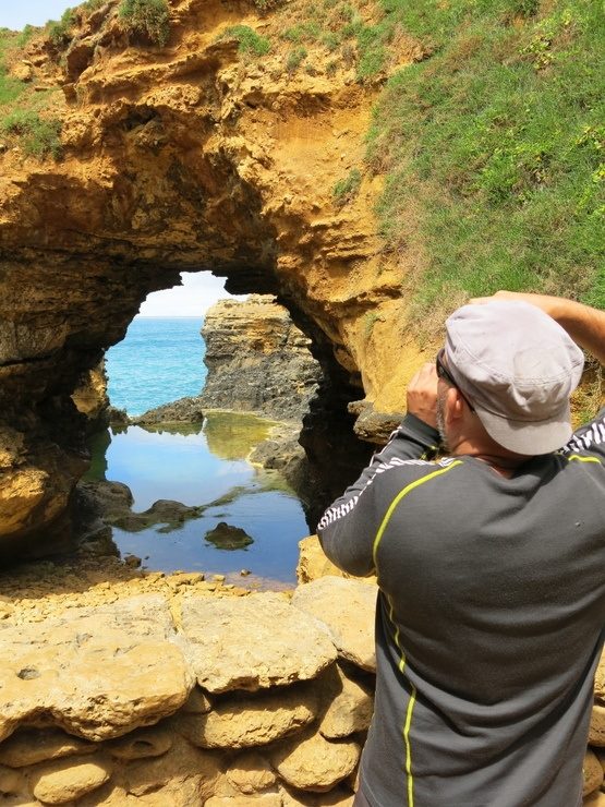 Ryan photographing a grotto in Australia. (Ryan is the master photographer in their traveling relationship.)