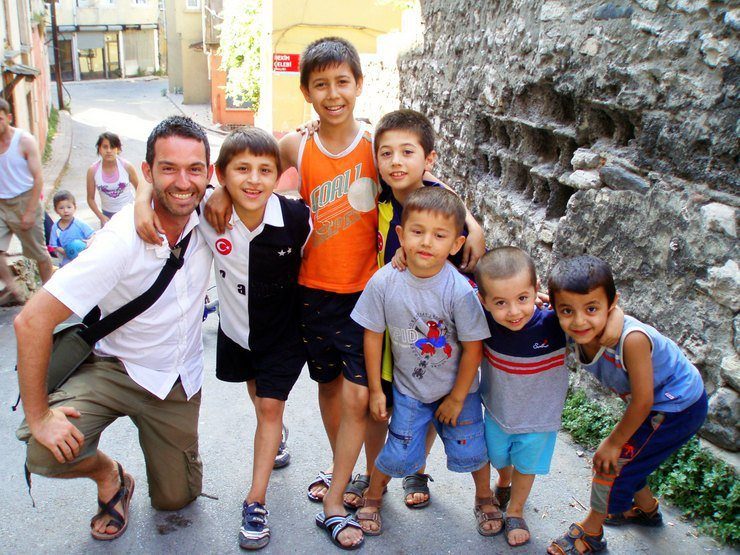 James with some young locals in a historic Istanbul, Turkey neighborhood.