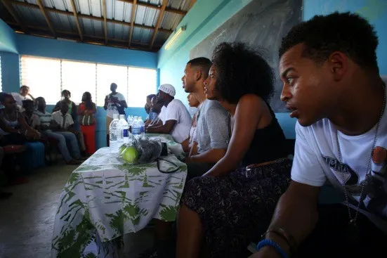 Shelah leading a talk-back in Kingston, Jamaica with actors Robert Ri'chard, Lance Gross, Raven Symone & others, June 2013.