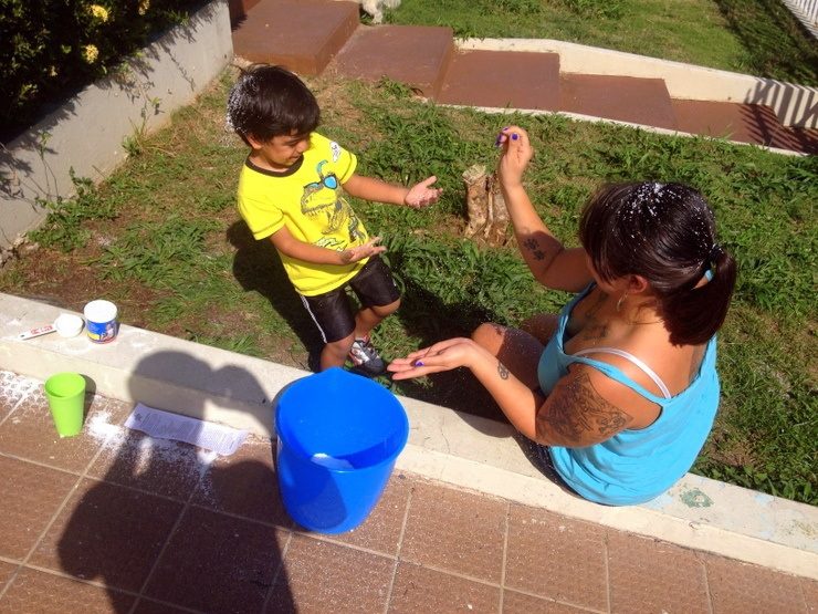 Rease in Puerto Rico, teaching her nephew, Noah, about snow (which he has never seen in real life!)