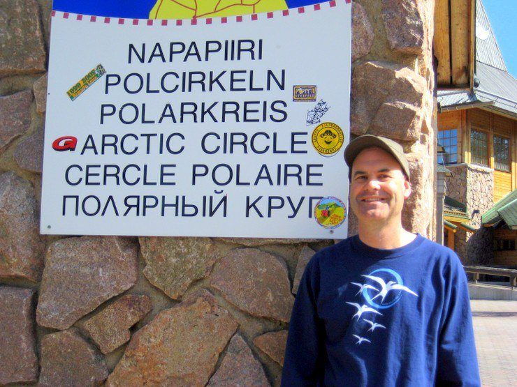 Posing at the Arctic Circle in Finland.