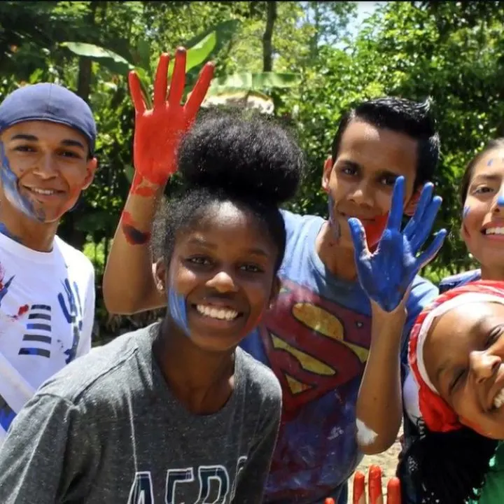 Irvin (on the left) volunteering in the Dominican Republic.