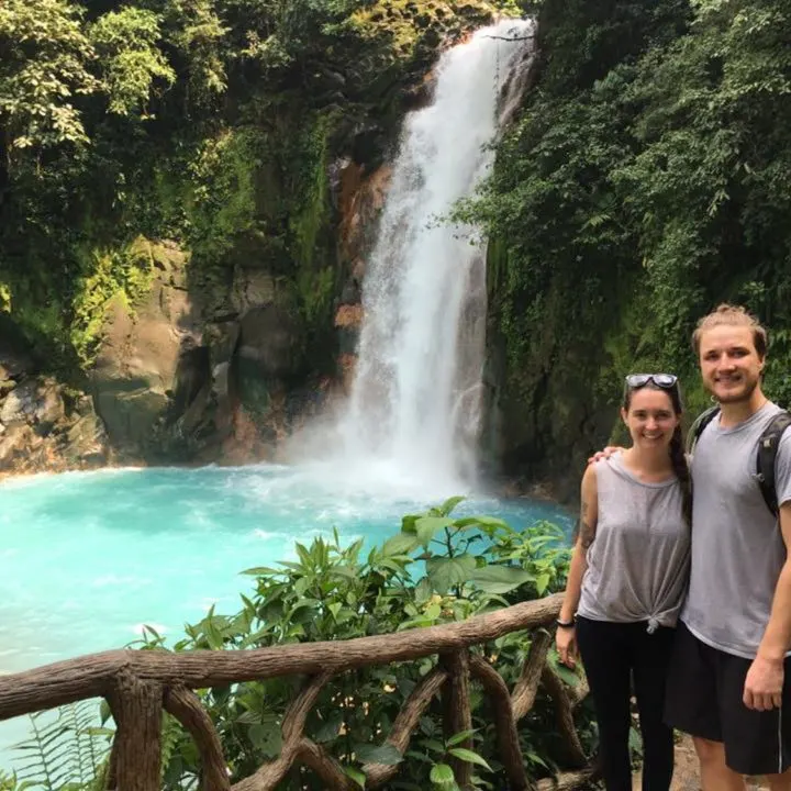 With a beautiful waterfall in Rio Celeste, Costa Rica.