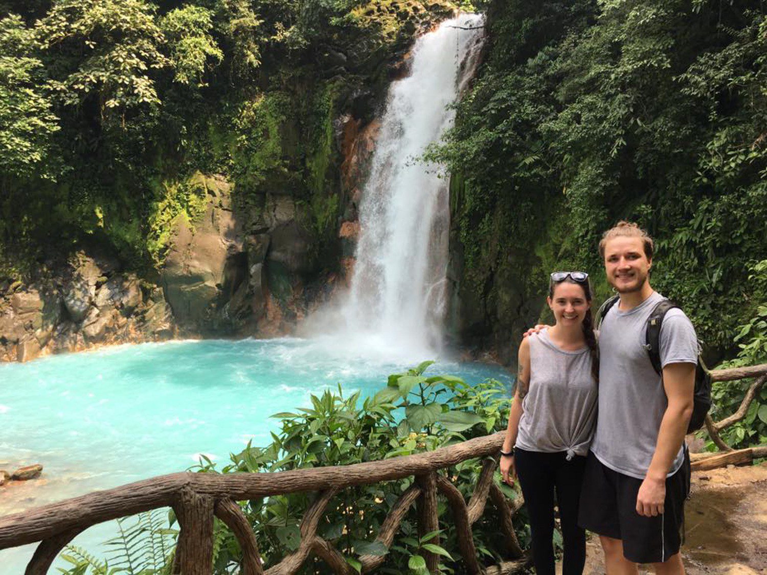 With a beautiful waterfall in Rio Celeste, Costa Rica.