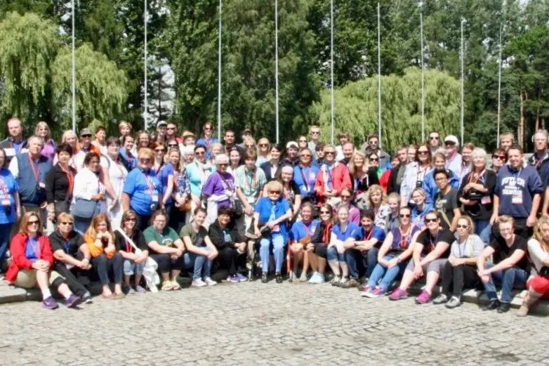 The educational travel group at the memorial area in Auschwitz. 