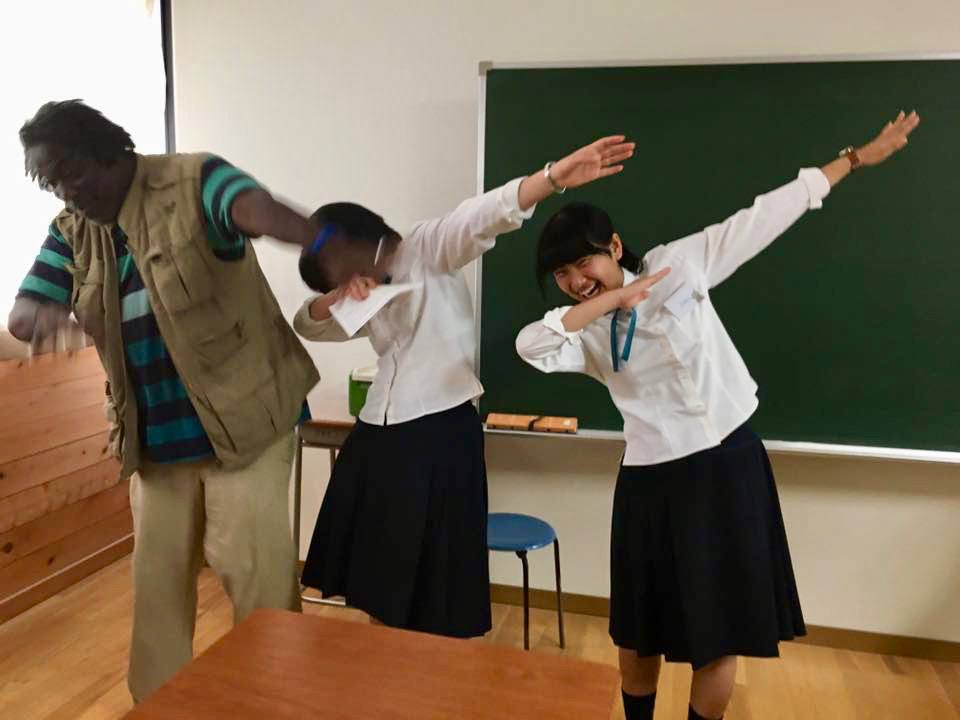 Dunn teaching Japanese students how to do the dance move, “The Dab.”