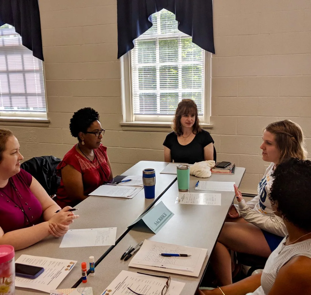 Tara Thomas in discussion with Fellow Educators During Training Session at Freedoms Foundation.