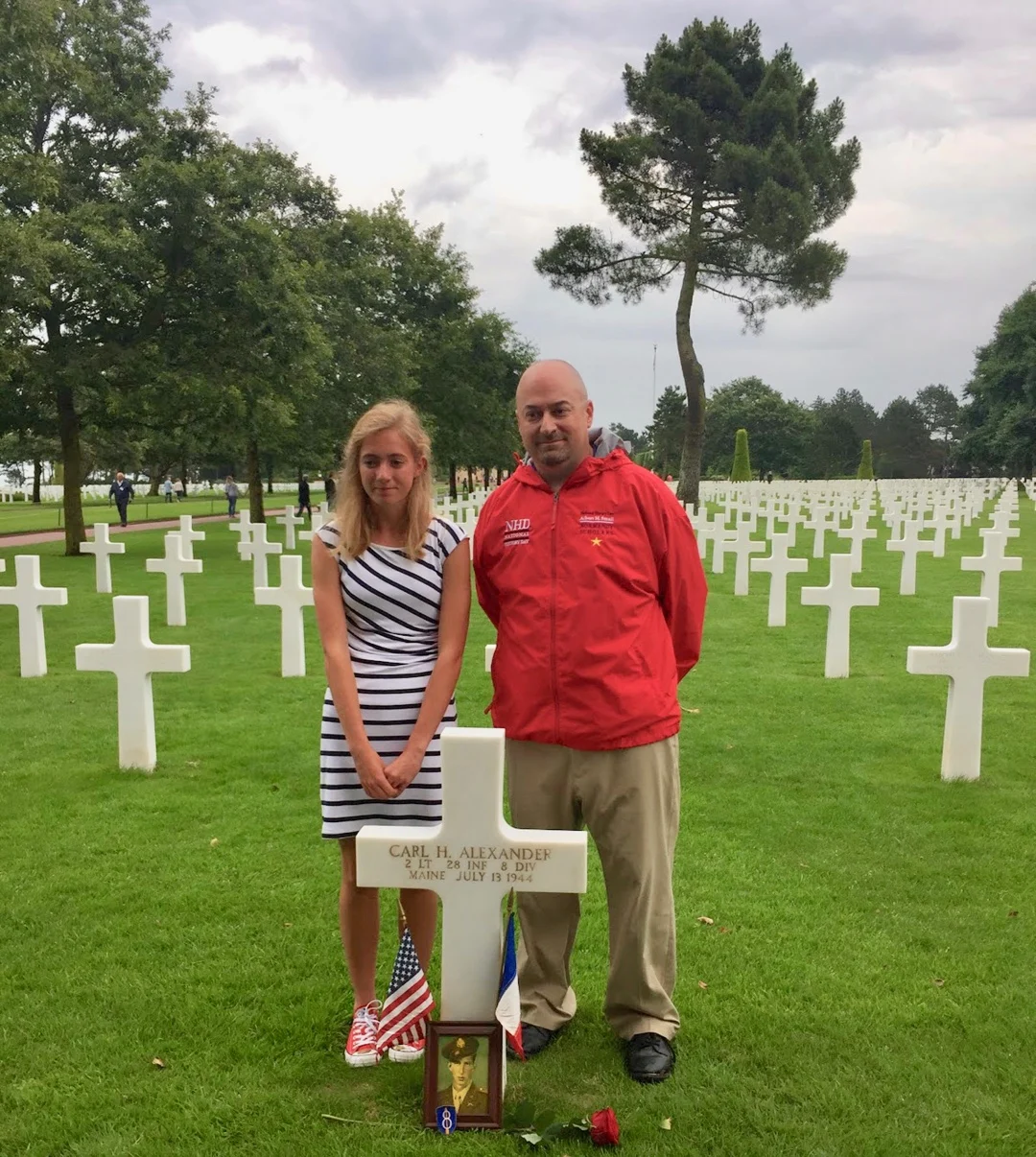 Teacher travel grants for History and Social Studies educators: 6 funded global education programs! With a student near the grave of 2nd Lt. Carl H. Alexander of Maine at the Normandy American Cemetery in France.