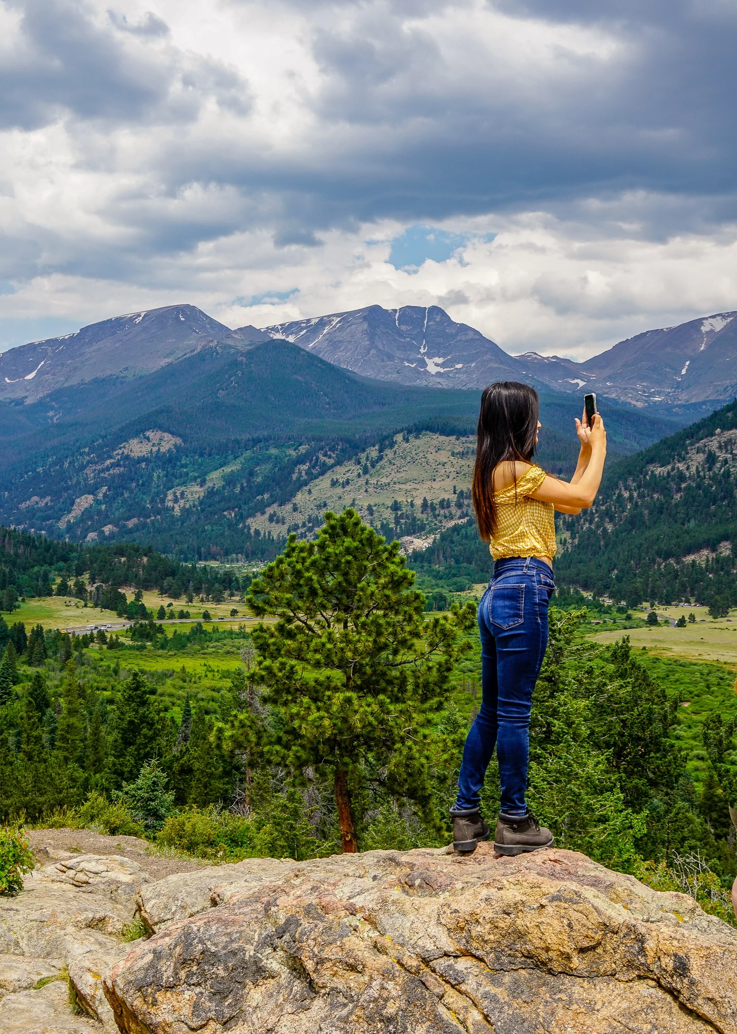 Photo at Rocky Mountain National Park overlook. Is she a traveler or traveller?