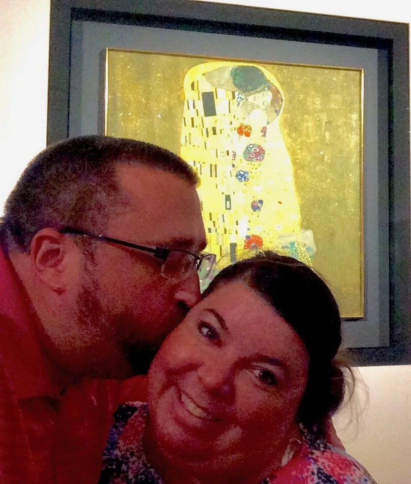 Todd and wife reenacting "The Kiss" by Gustav Klimt in Vienna.