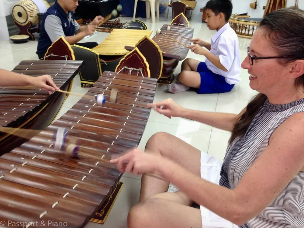 Fiona trying out a traditional Thai instrument.