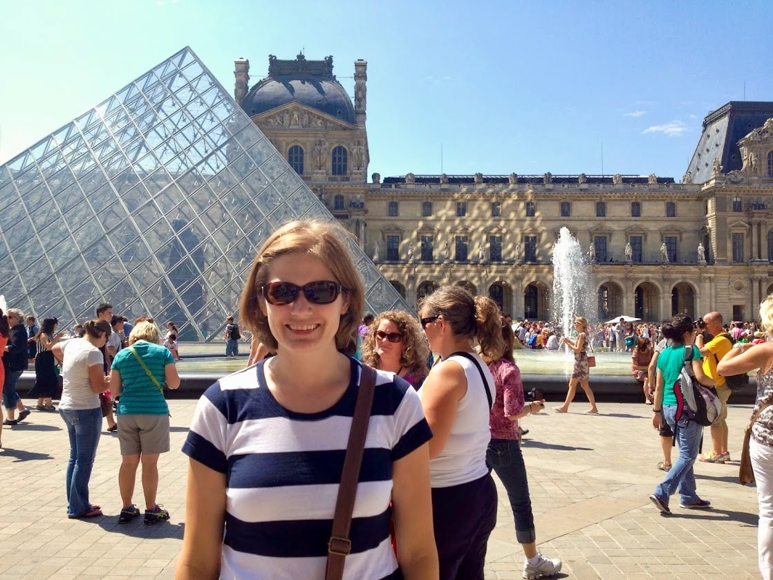 Christy in front of the Louvre on her first trip to Paris.
